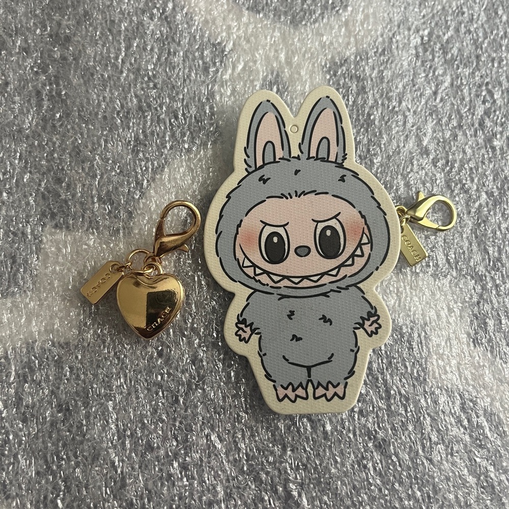 New Gold Heart Zipper Pull Bag Charm With A Mystery of Equal Value Bag Charm.